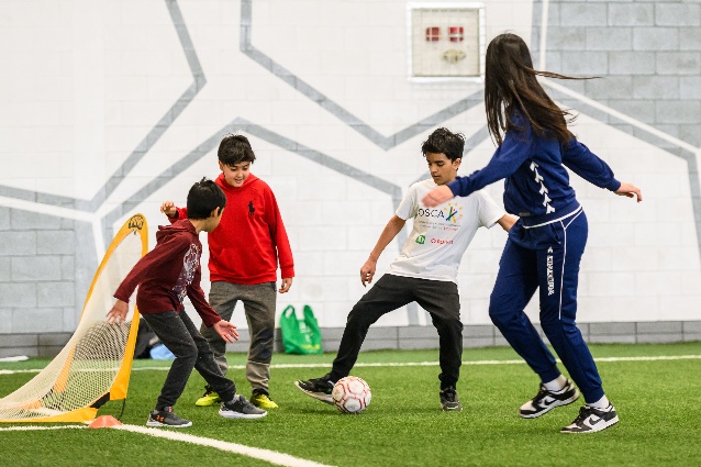 An image of a group of people playing soccer at a Recreation Centre