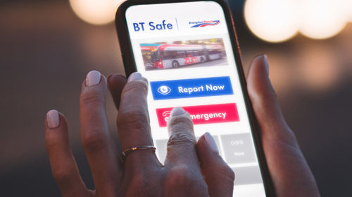 Person holding a cellphone using the BT Safe app